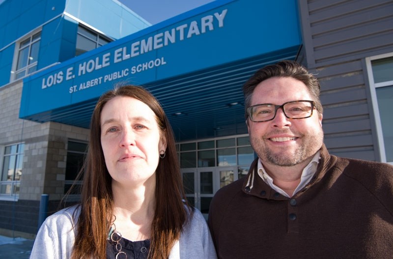 ALMOST READY – Lois E. Hole Elementary vice-principal Monique Waters and principal Kevin Jones show off the front of their new school in Erin Ridge North. Construction of the 