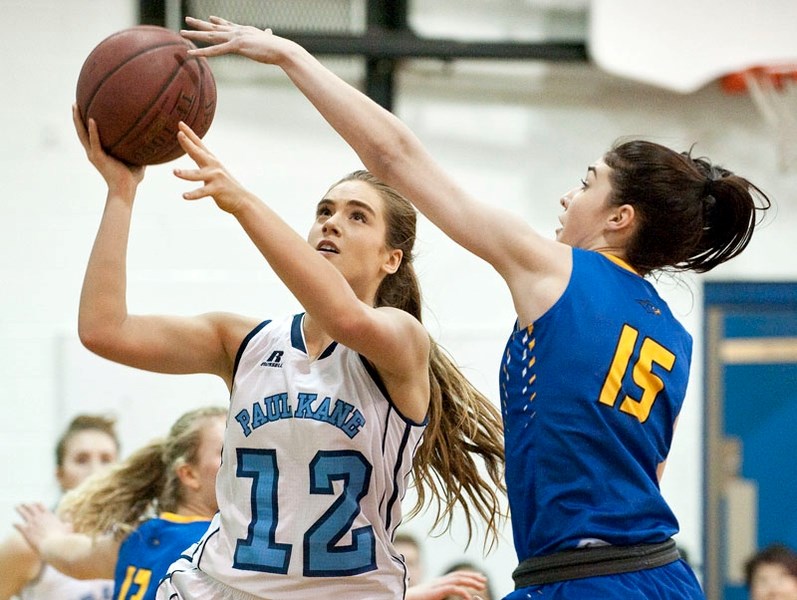 DEFENSIVE CHALLENGE – Sarah Dedrick of the St. Albert Skyhawks attempts to stop a scoring play by Anika Steele of the Paul Kane Blues in Wednesday&#8217;s 4A Edmonton zone