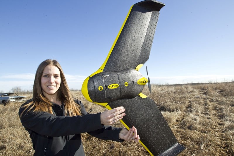 REGULATED — Ellen Christopherson of St. Albert&#8217;s Elevated Robotic Services shows off the senseFly eBee drone that her company uses to create topographical maps of