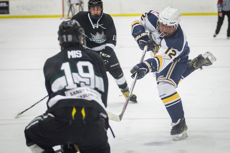 CRUSADER â€“ Noah Fayad of the St. Albert Source for Sports Crusaders fires a shot during Northern Alberta Midget AA Hockey League action. The Crusaders and Strathcona