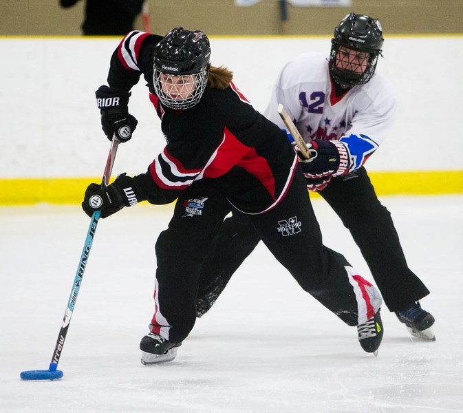 RING RUSHER – Liv Helland of the U19AA St. Albert Mission pulls away from a defender during the Freson Bros. Canadian Ringette Championships. The Mission finished fourth