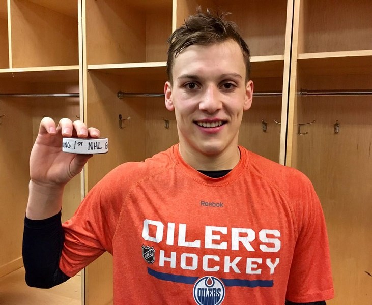 FIRST GOAL â€“ Matt Benning of St. Albert shows off the puck that he fired past Cory Schneider of the New Jersey Devils for his first National Hockey League goal Jan. 7. The