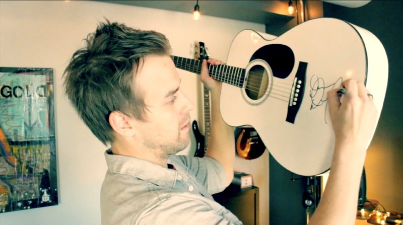 St. Albert country recording artist Dan Davidson is giving away his infamous guitar that travelled to Japan for the Barn Burner video shoot.