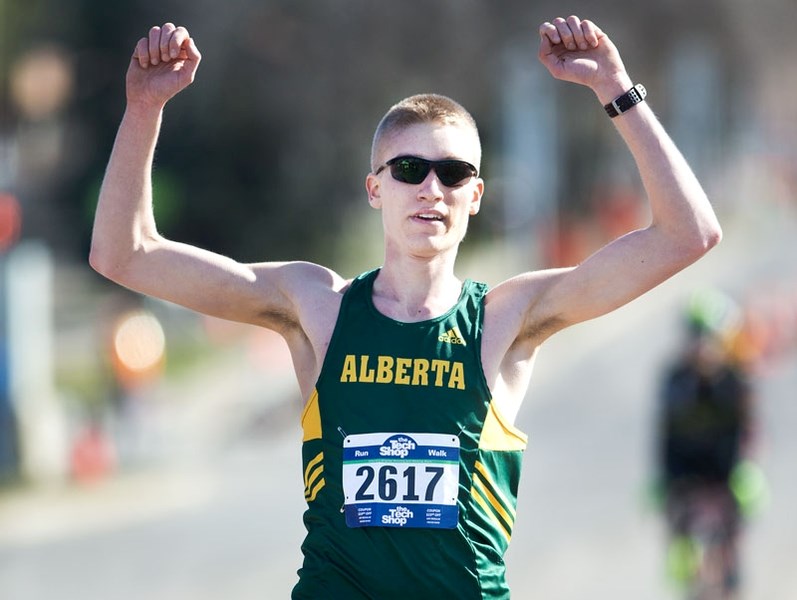 DEFENDING CHAMPION – William Madsen of Edmonton celebrates his victory in last year&#8217;s 10-miler at the Landrex St. Albert Road Race. The winning time was 53 minutes and