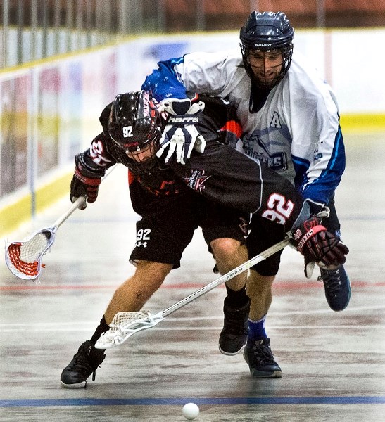 HARASSMENT â€“ Ben Snider of the St. Albert Miners is roughed up from behind during the 2016 senior B provincial final against the Calgary Mountaineers. The Miners
