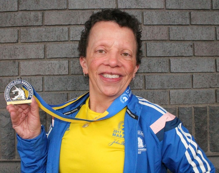 MARATHONER – Shawne Flaherty displays her Boston Marathon medallion from the April 17 competition. The avid St. Albert runner completed the 121st annual marathon in six hours 