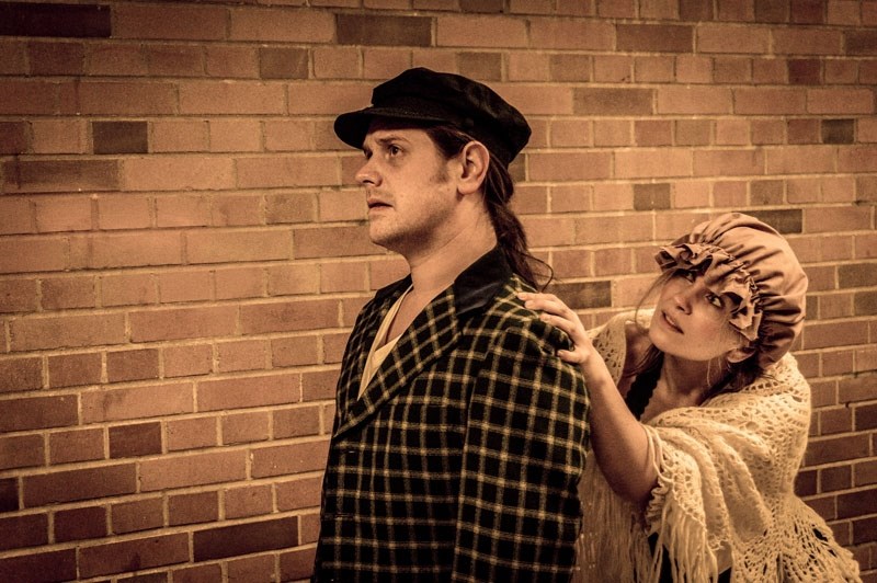 The mad Beggar Woman (Nadine Veroba) begs Anthony Hope (Matt Boisvert) for a few alms in Sweeney Todd: Demon Barber of Fleet Street now running at the Westbury Theatre.