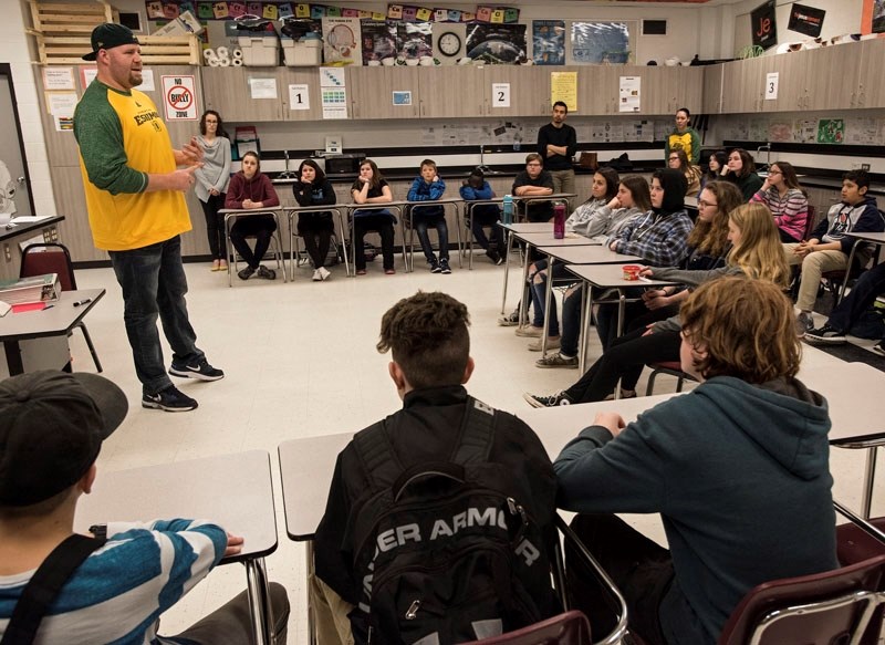 LEADING THE WAY â€“ Offensive lineman Justin Sorensen of the Edmonton Eskimos speaks on leadership to students in grades 7 to 9 at Elmer S. Gish School last week as part of