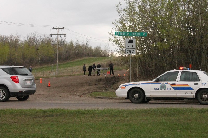 RCMP remove the body of a man found on Poundmaker Road in St. Albert on Wednesday morning.