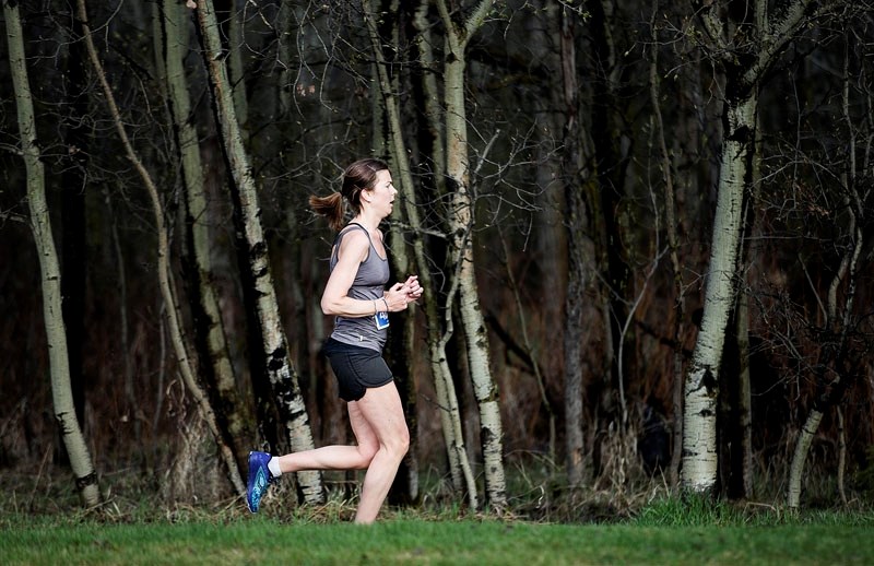 RUNNING SOLO – Colette Agnew is all alone running along the Red Willow Trail system through Kingswood Park during the Leading Edge Physiotherapy RunWild half-marathon. The