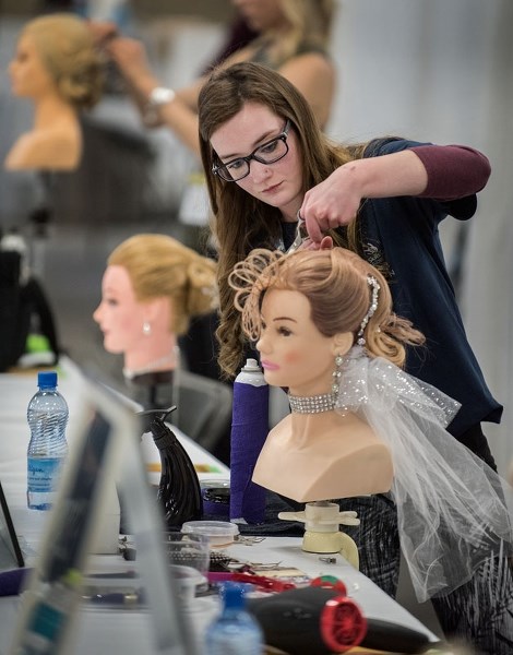 GOLDEN LOCKS – Grace Arndt of Sturgeon Composite High School competes in the intermediate bridal hairstyling competition during the 2017 Provincial Skills Canada Competition