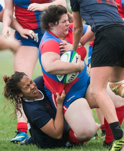 USE OF FORCE – Meghan Thomas is yanked down by the Clan in Saturday&#8217;s 22-22 draw at the St. Albert Rugby Football Club. The Clan rallied from a 12-point deficit to pull 