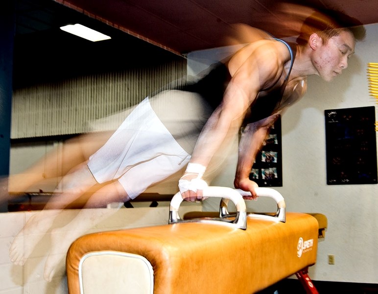 Isaiah Wong practices at Dynamyx Gymnastics Club in preparation for nationals.