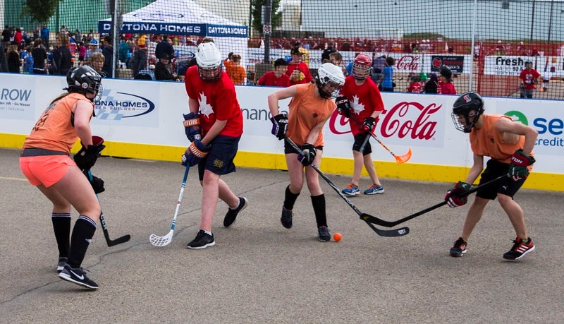 The Canadians from St. Albert (in red) battled the Hounds of Hell from Edmonton during the 2016 Road Rage street hockey tournament at Servus Credit Union Place.
