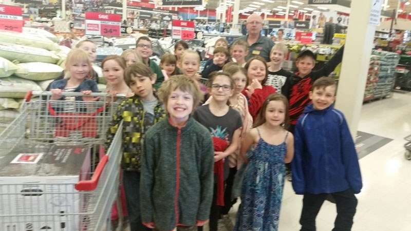Dolores Andressen&#8217;s Grade 2/3 split class at Bertha Kennedy buys two microwaves with the Canadian Tire money that they collected. The electronics were then donated to