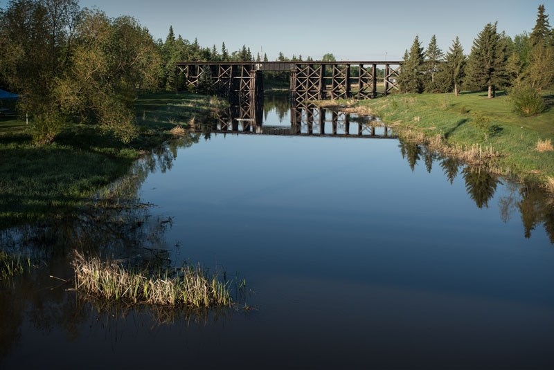 FLOW OF HISTORY – The Sturgeon River looking west toward the train trestle in St. Albert