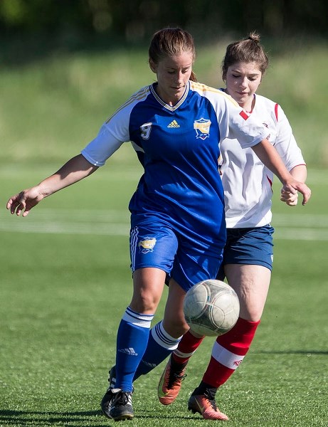 BALL TRACKER â€“ Michelle Smith of the St. Albert Impact Premier team plays the ball in front of a defender in Sunday&#8217;s 3-0 loss to Northwest United at the ESA Complex. 