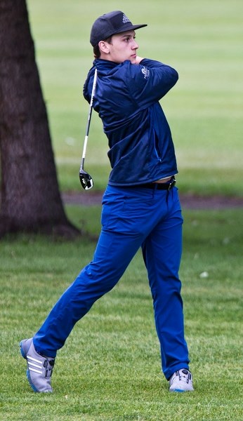 FORE! &#8211; Edmonton Oilers defenceman Matt Benning shows off his golf swing at the second annual Merch Madness Cup tournament Friday at the Sturgeon Valley Golf &amp;
