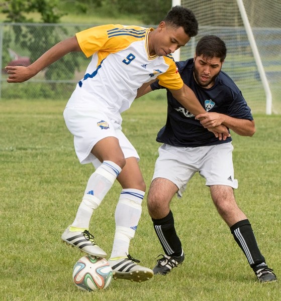 ON THE BALL â€“ Scott Robson of the St. Albert Impact controls the ball while pressured in Tuesday&#8217;s division 2A match against Strikers HPP at Riel Park. The