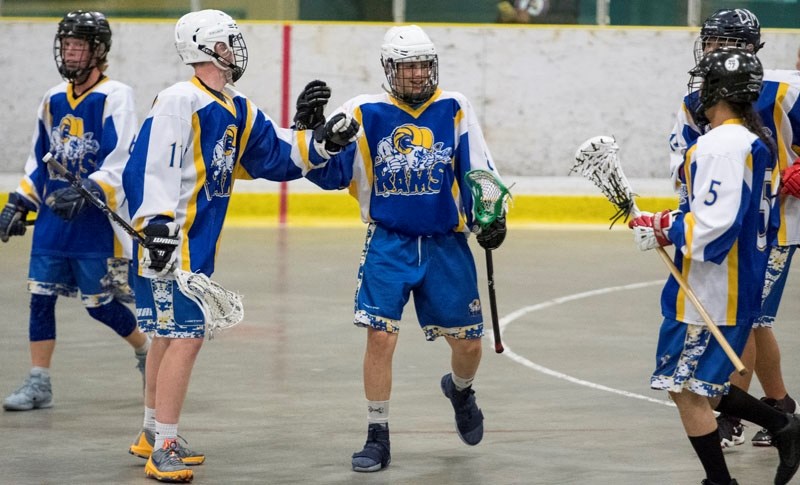 MIDDLE MAN â€“ Kieran Harris of the St. Albert Midget A Zone Rams celebrates his first-period goal with Ronin Pusch