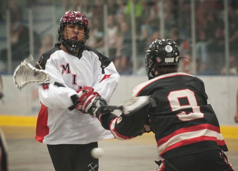 TRIGGERMAN &#8211; Keegan Bal of the St. Albert Miners fires a shot on net past Edmonton Warriors&#8217; defender Matt Murphy during the Darian Mar No. 77 Memorial Game in