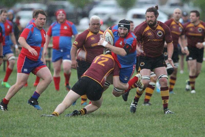 UPENDED &#8211; Brett Kelly is tackled by Marcus Brooker of the Nor&#8217;Westers
