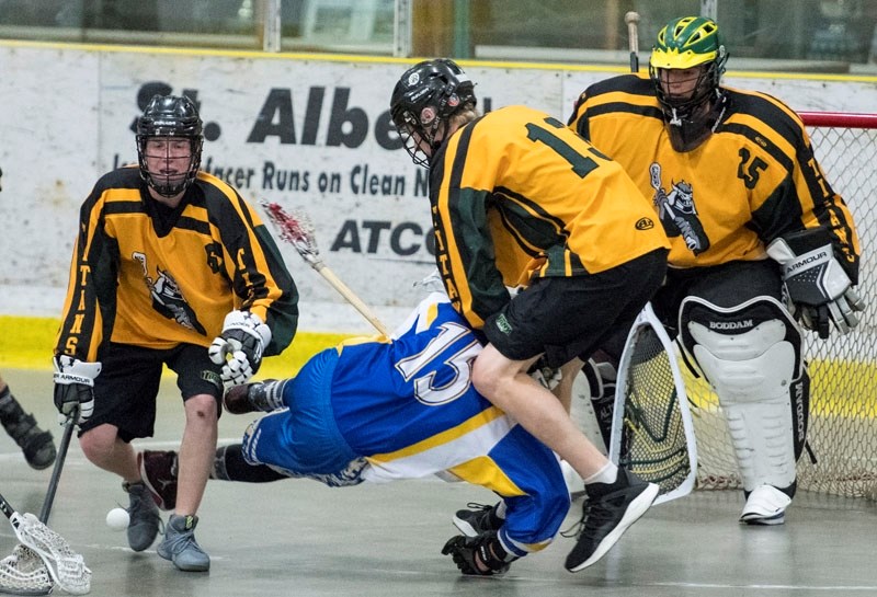 STRONG-ARMED &#8211; Jack Rainault of the St. Albert Midget A Zone Rams is roughed up by Ryan Simard of the Sherwood Park Titans in last week&#8217;s 8-7 loss at Kinex Arena. 