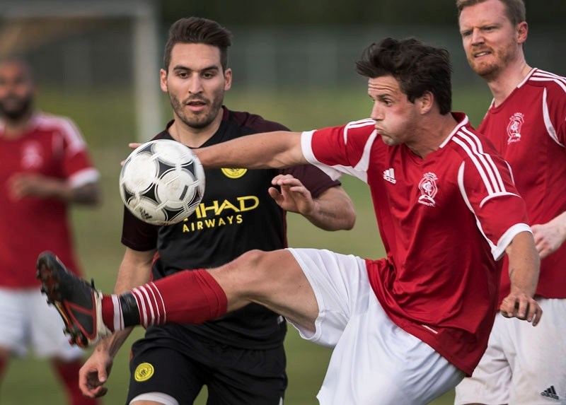 HIGH KICK &#8211; Will Backhouse of the St. Albert Rangers gets a foot on the ball in front of Patrick Ten Eyck of Man City during Monday&#8217;s division 1A match at the ESA 