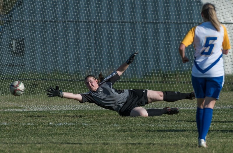 STRETCH PLAY â€“ St. Albert Impact goalkeeper Miranda Klein made a valiant effort but was unsuccessful stopping this shot by the Edmonton Warriors in Monday&#8217;s division