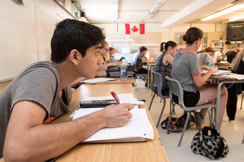 Yousuf Rizvi hard at work in a math 30 class at Bellerose high school on Thursday. Hundreds of St. Albert students are taking summer school classes at Bellerose. Paul Kane