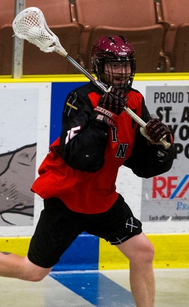 Tom Buckley carries the ball across the blueline during Sunday&#8217;s game against the Outlaws.