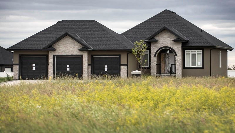 Notices attached by Alberta Health Services to the exterior of this home at 306 Northern Lights Estates claiming deadly material inside and prohibiting human habitation as