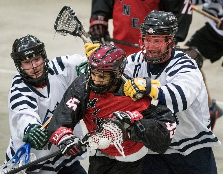 MUGGED â€“ Keegan Bal of the senior B St. Albert Miners is harassed by a pair of Calgary Mountaineers in game two of the best-of-five semifinal in the Rocky Mountain Lacrosse 