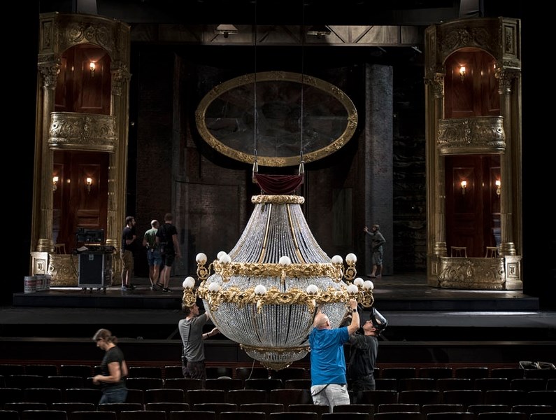 Stagehands work on the chandelier for the stage production of Phantom of the Opera in preparation for the matinée at the Jubilee Auditorium in Edmonton Thursday.