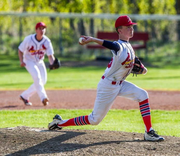 PACKING HEAT – Kade Knight winds up to pull the trigger for the midget AA St. Albert Cardinals