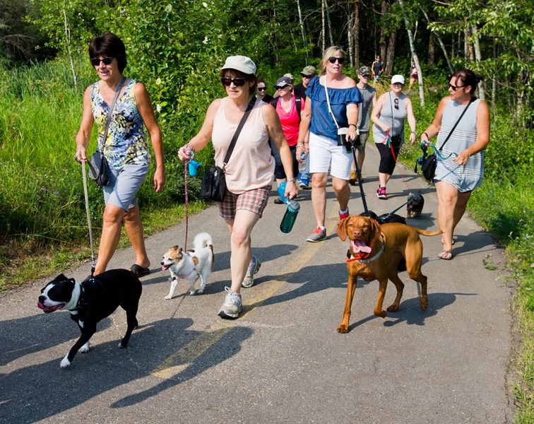 Walkers of both the two and four-legged variety took to the Red Willow Trail along the Sturgeon River on Saturday during the 13th annual Tails on the Trails charity
