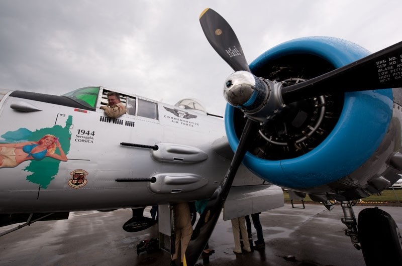 smiles as he prepares to board the B-25J &quot;Maid in the Shade&quot; bomber that visited Villeneuve Airport last weekend. Regehr