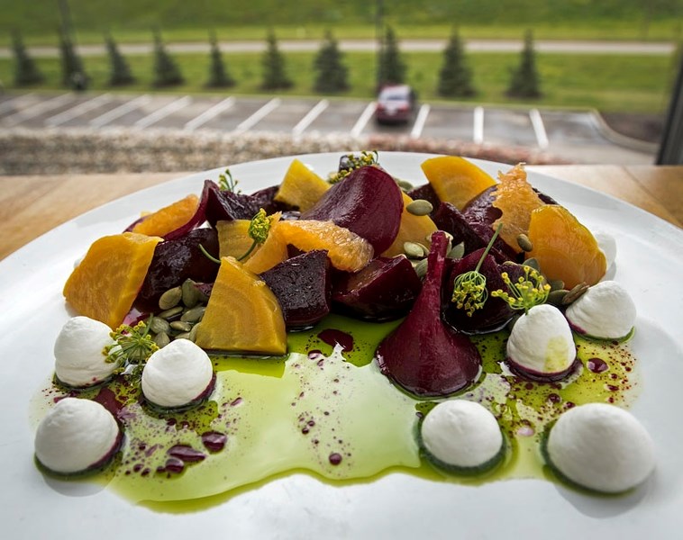 with a beet salad and ling cod dishes at his dining room in St. Albert.