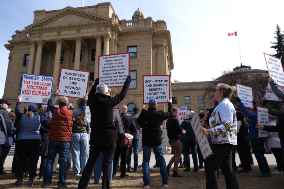 Protestors at the Alberta legislature call on Premier Danielle Smith to withdraw a bill that would add more consumer protections to life lease agreements. 