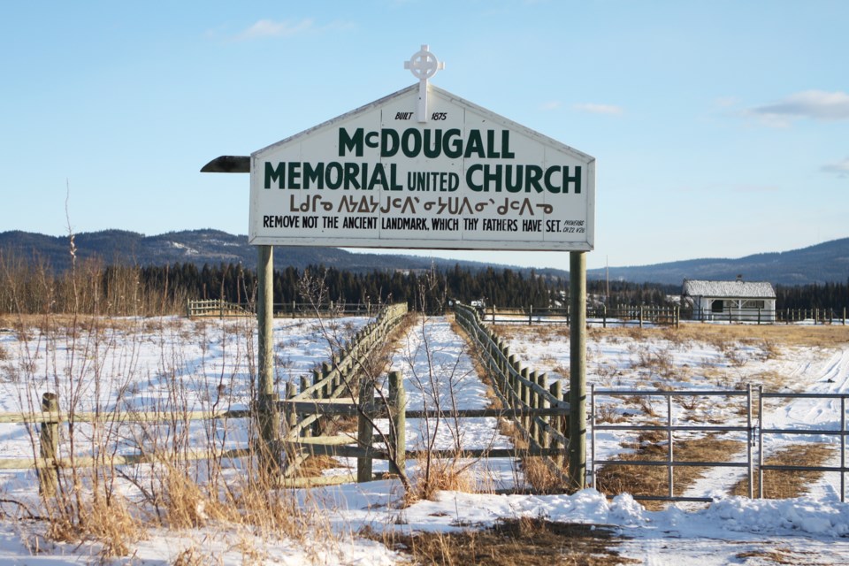 The sign over the path that once led to the McDougall Memorial United Church reads “Remove not the ancient landmark, which thy fathers have set." CLAIRE THEOBALD/Local Journalism Initiative