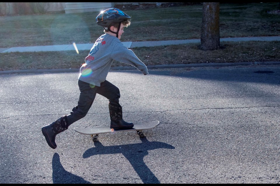 Easton Woelinga 6 plays on the street in Braeside St. Albert on Nov. 18. 
