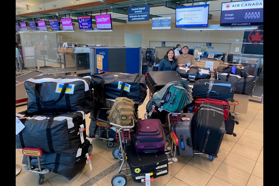  St. Albert's Shannon Boddez and Dave Bryenton at the Edmonton International Airport in September with bags of luggage filled with medical supplies and other items destined for Ukraine. Photo supplied