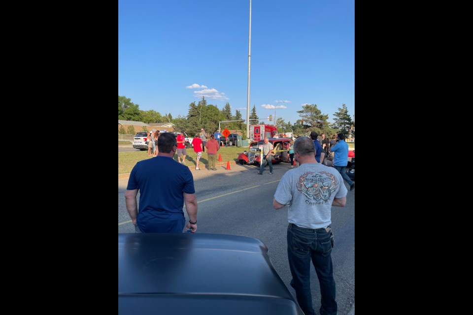Bystanders are watching as RCMP investigate an incident at Rock'n August on Thursday Aug. 8.