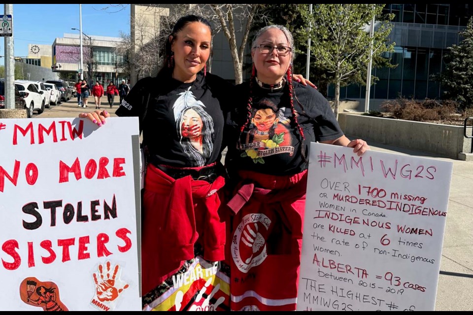 St. Albert's Alanna Tyler(l)  and Rhonda Wood-Viscarra (r) pose outside city hall in Edmonton on Red Dress day to remind Albertans of missing and murdered Indigenous women who have not returned home . JACKIE CARMICHAEL/ St. Albert Gazette