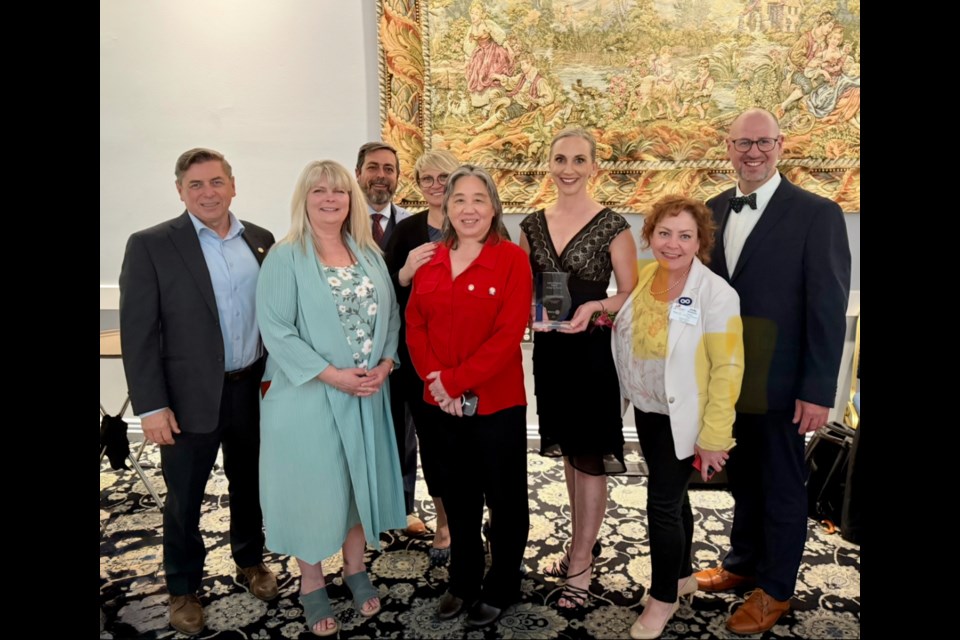 Corinna Dooley with members of the Rotary Club of St. Albert at the 31st Rotary gala. Left to right: Darel Baker, Cathy Heron, John Carle, Darijia Slokar, Sandra Fenton, Corinna Dooley, Jody Swanson and David Dooley.