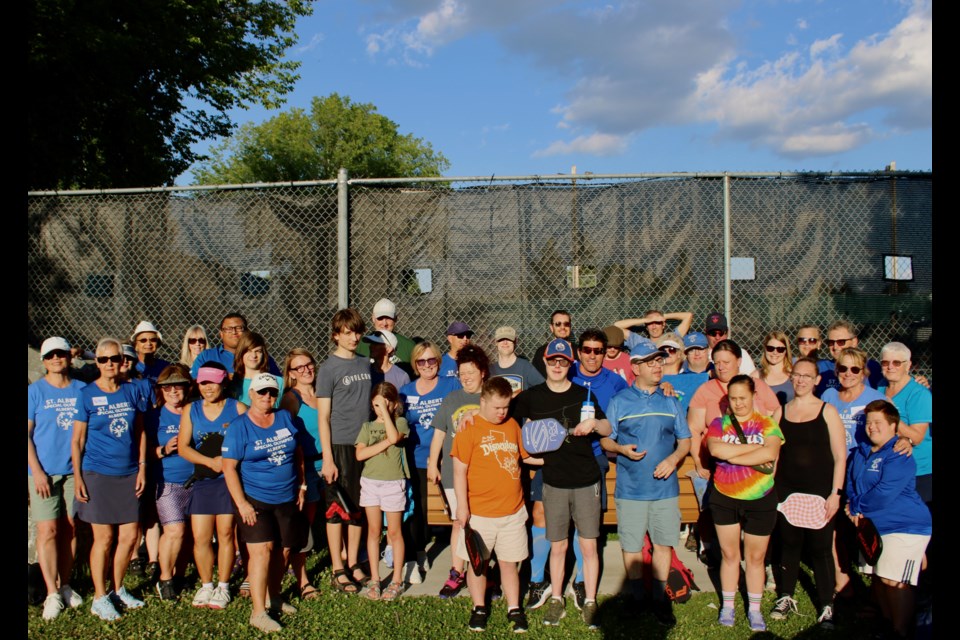 Athletes, coaches, family and friends  gather to celebrate the end of the St. Albert Special Olympics pickleball season. 