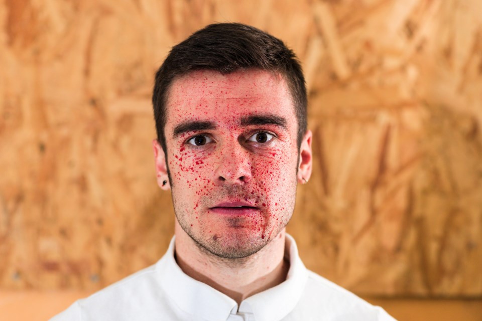 Jack Walker as Eugene Crowley, covered in blood, encapsulates the unravelling chaos of his character in The Bone House. 