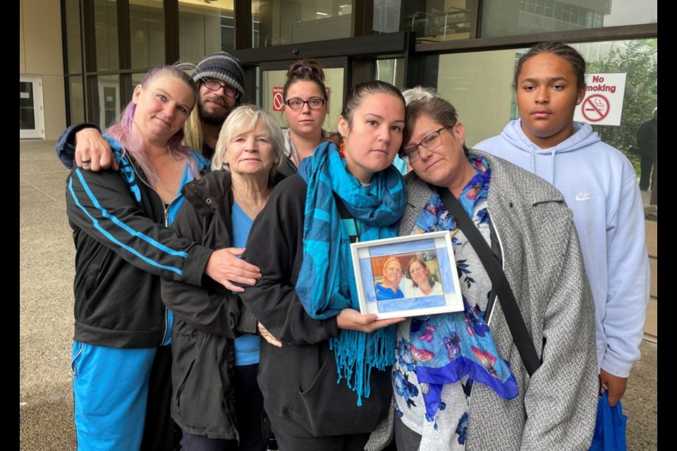 Stacey Worsfold (centre right) poses with loved ones outside of the courthouse in June.