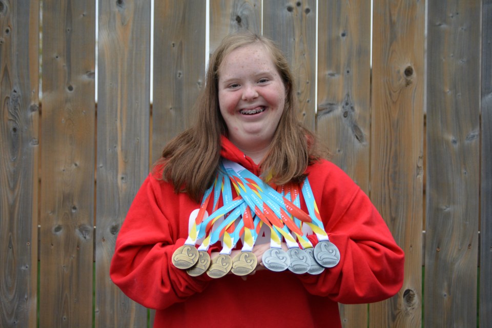 Amiera Black, 16, with her recently won silver and bronze medals. 