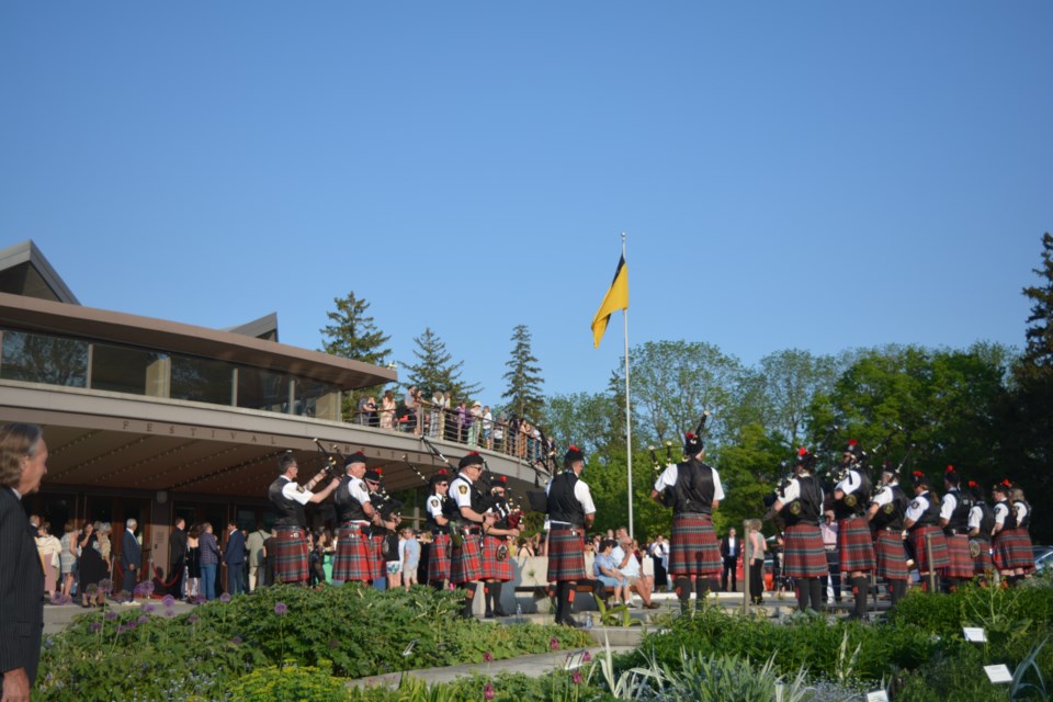 The Stratford Police Pipes and Drums in front of the Festival Theatre, bringing in the official start to the 71st Stratford Festival season Tuesday night.